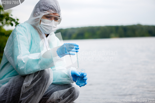 Image of Chemist takes water for examination