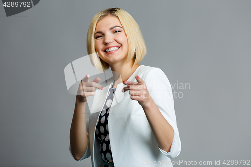 Image of Woman showing fingers in camera