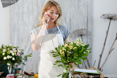 Image of Florist woman talking on phone