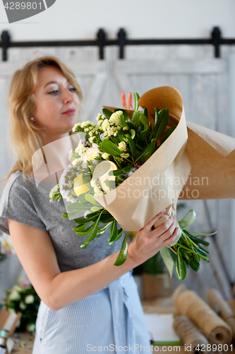 Image of Photo of florist in apron