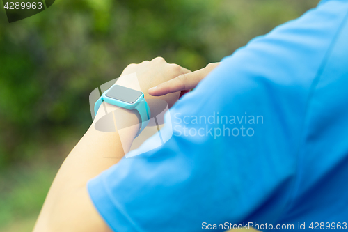 Image of Man using smart watch