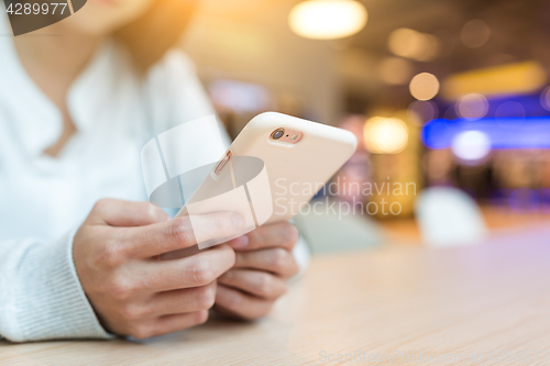 Image of Woman use of mobile phone