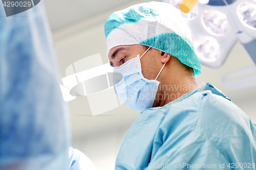 Image of group of surgeons in operating room at hospital