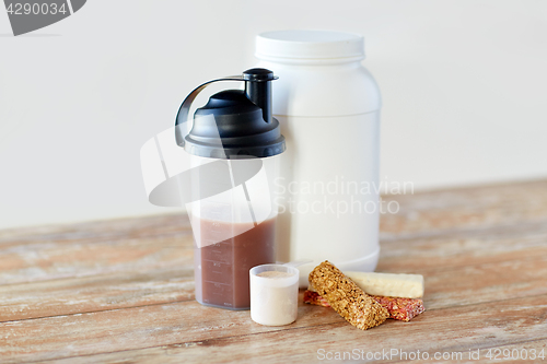 Image of food and sports nutritional additives on table