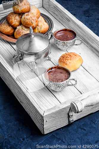 Image of Profiteroles and hot chocolate