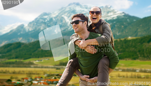 Image of happy couple with backpacks traveling in highlands