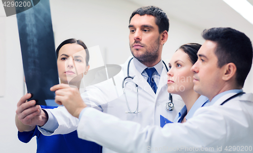 Image of group of medics with spine x-ray scan at hospital