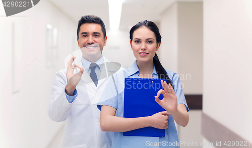 Image of doctor and nurse showing ok sign at hospital