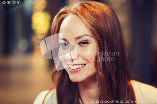 Image of smiling happy young redhead woman face