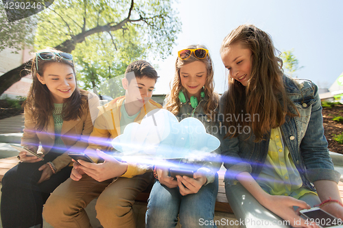 Image of happy teenage friends with smartphones outdoors
