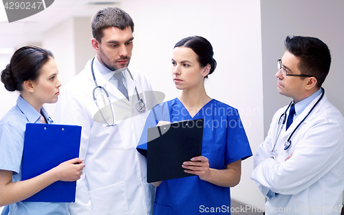 Image of group of medics at hospital with clipboard