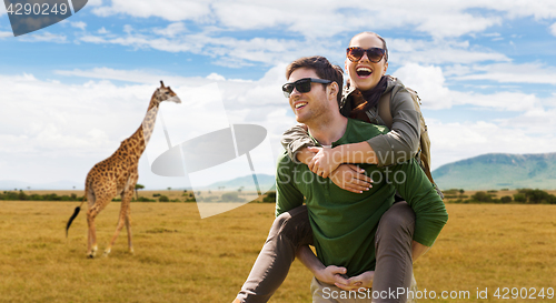 Image of smiling couple with backpacks traveling in africa