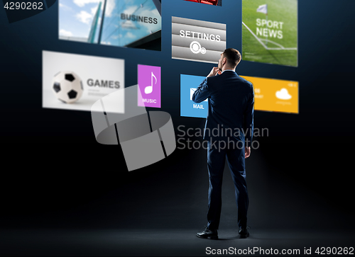 Image of businessman looking at virtual applications