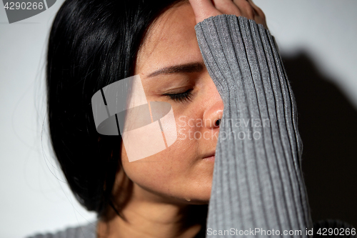 Image of close up of unhappy crying woman