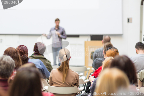 Image of Man giving presentation in lecture hall at university.