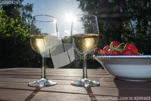 Image of Backlit glasses with sparkling wine