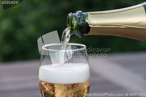 Image of Pouring sparkling wine in a glass