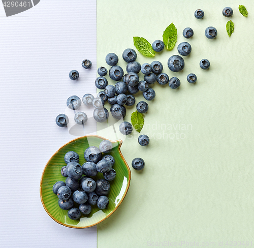 Image of blueberries on colorful paper background