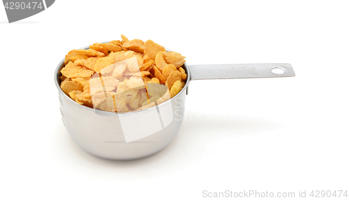 Image of Corn flakes breakfast cereal in a measuring cup