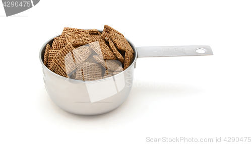 Image of Malted shredded wheat biscuits breakfast cereal in a measuring c