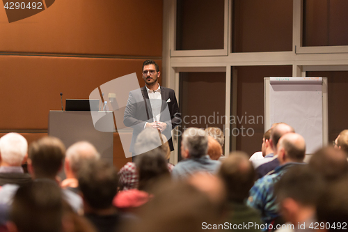 Image of Business speaker giving a talk at conference meeting.