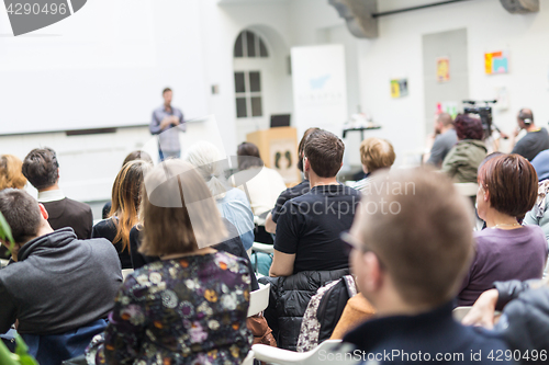 Image of Man giving presentation in lecture hall at university.