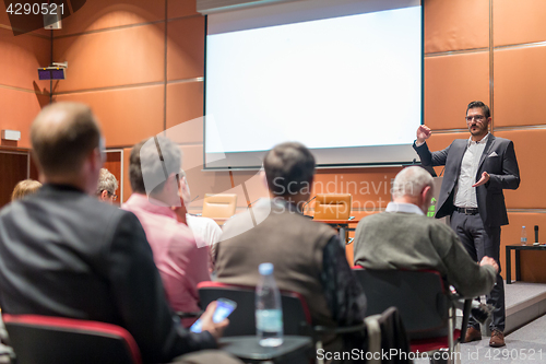 Image of Business speaker giving a talk at business conference event.