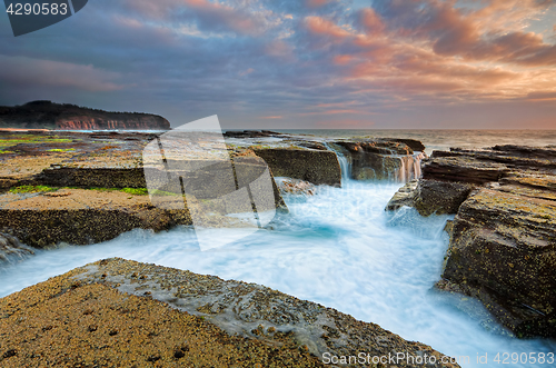 Image of Sunrise  from the eroded rocky channel at North Narrabeen