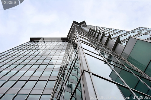 Image of Modern Steel and Glass Office Building on Gray Day