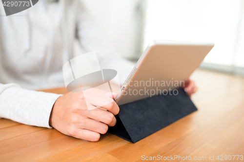 Image of Woman using tablet computer