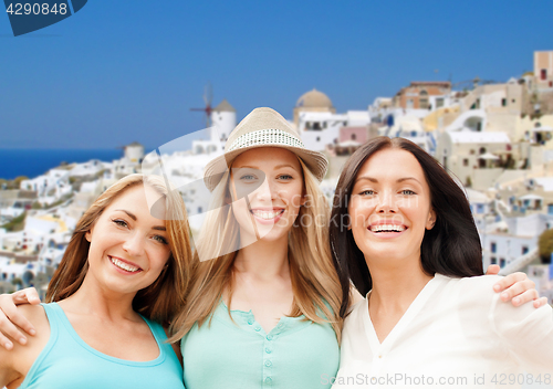 Image of happy women over santorini island background