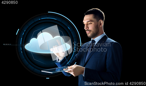 Image of businessman with tablet pc and cloud projection