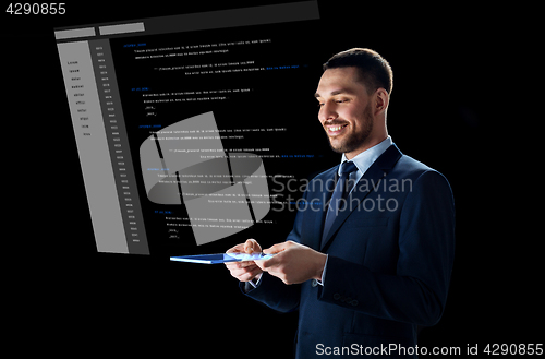 Image of businessman with tablet pc and virtual coding