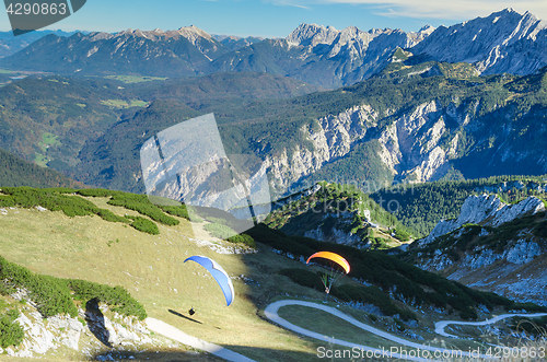 Image of Pair paraplanes launching and soaring in Bavarian Alps mountains