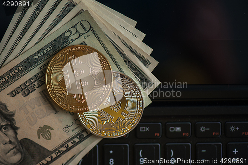 Image of Bitcoin coins with dollars