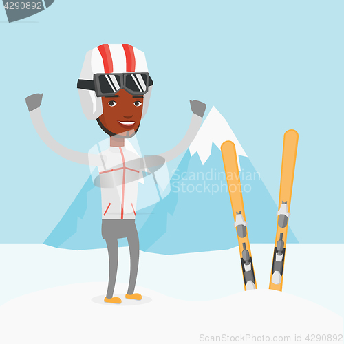 Image of Cheerful skier standing with raised hands.