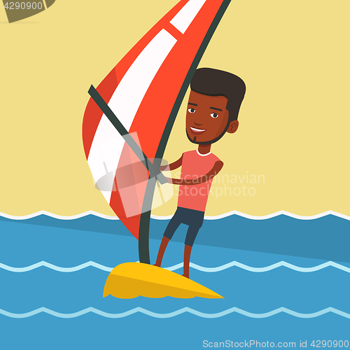 Image of Young man windsurfing in the sea.