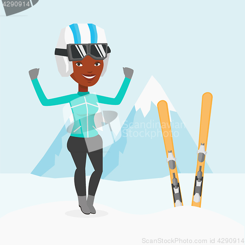 Image of Cheerful skier standing with raised hands.