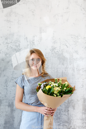 Image of Long-haired florist on empty background