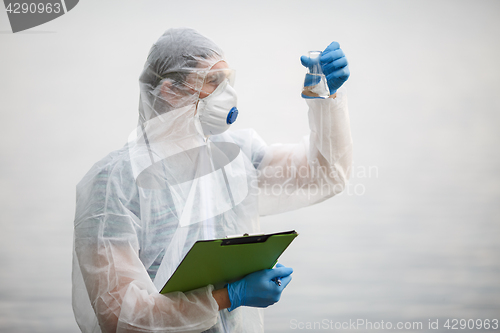 Image of Biologist with bulb and folder