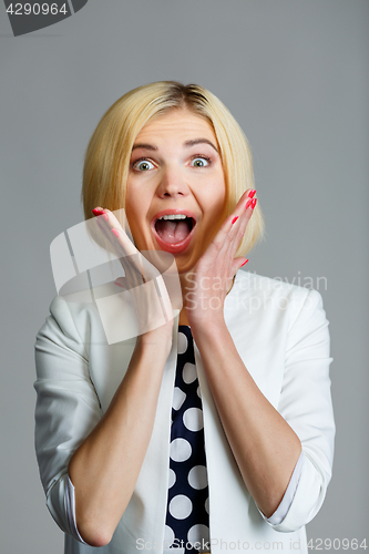 Image of Model with hands on face