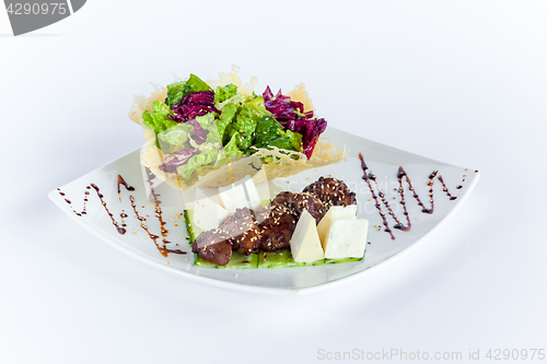 Image of Close Up of Rack of Saucy Barbecue Pork Served on Plate in Restaurant