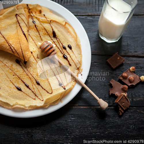 Image of Stack of tasty pancakes with butter and honey for breakfast