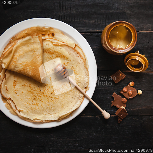 Image of Stack of tasty pancakes with butter and honey for breakfast