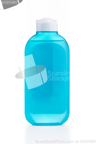 Image of The blue plastic bottle with blue empty label isolated on white