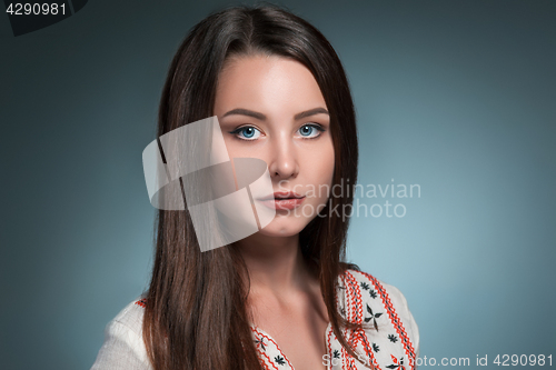 Image of The beautiful girl in National Ukrainian Costume at studio.