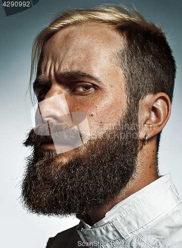 Image of Portrait of hipster bearded man\'s side face.