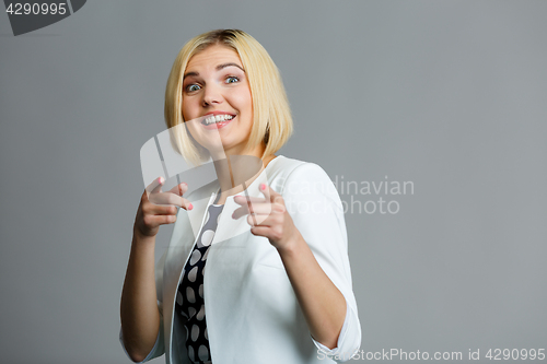 Image of Blonde showing fingers in camera