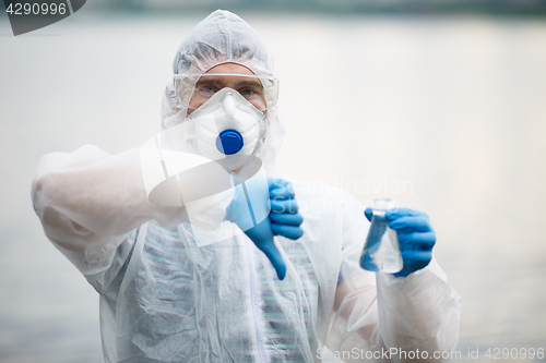 Image of Lab assistant with test tube