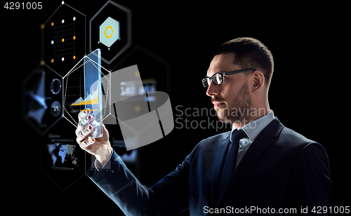 Image of businessman with tablet pc and virtual projections